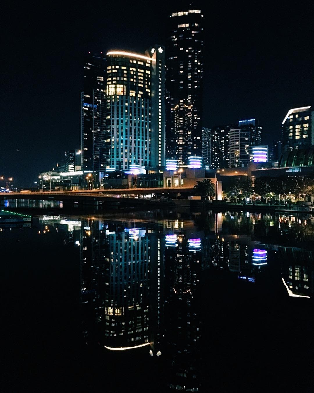 Crown Melbourne and Southbank lit up at night along the river